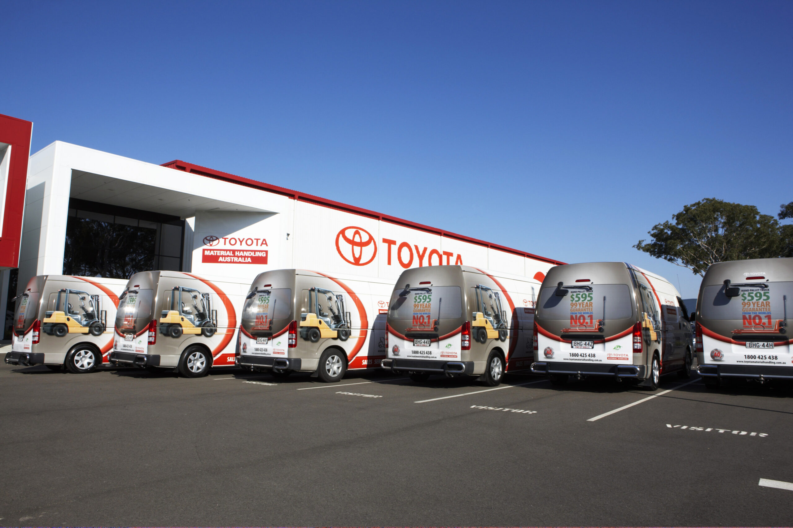 Why is it called "fleet graphics"? Because you wrap your fleet in graphics! A classic example - some of the TMHA service fleet parked at TMHA head office, highlighting the power of branding and the role of fleet graphics in magnifying that power.
